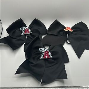 Black Cheer Bows with Alabama pins on the hair bows there’s three of them